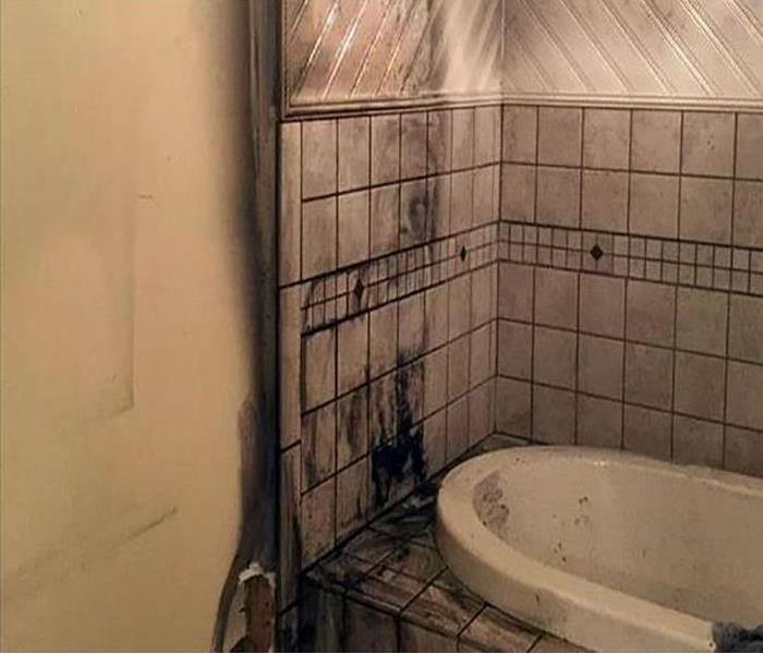 bathroom suffering from soot damage after a fire