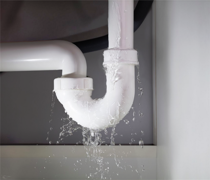 water leaking from a white pipe
