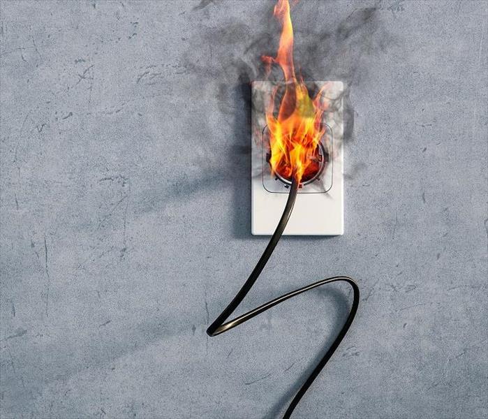Cord plugged into outlet burning