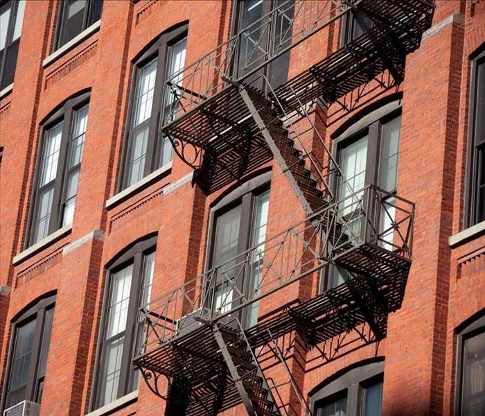 fire escape on brick many stories building